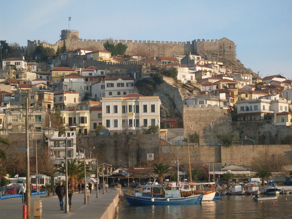 Aerial view of Kavala Port, Greece with ferry docks and city background